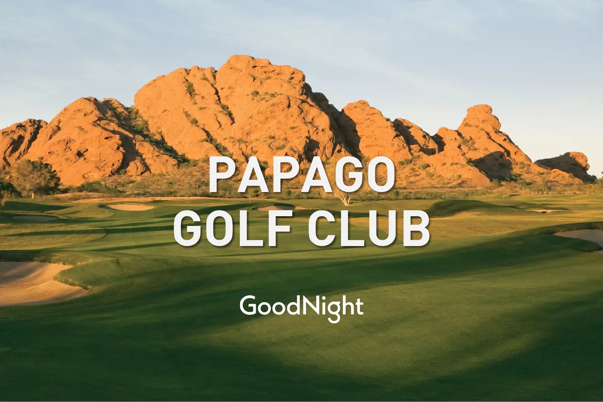 A tranquil golf course framed by unique rock formations and an expansive sky, capturing golfers mid-game. The scene radiates relaxation and camaraderie, suitable for both casual and competitive group outings. The warm light of sunset adds an inviting, social mood to the landscape.